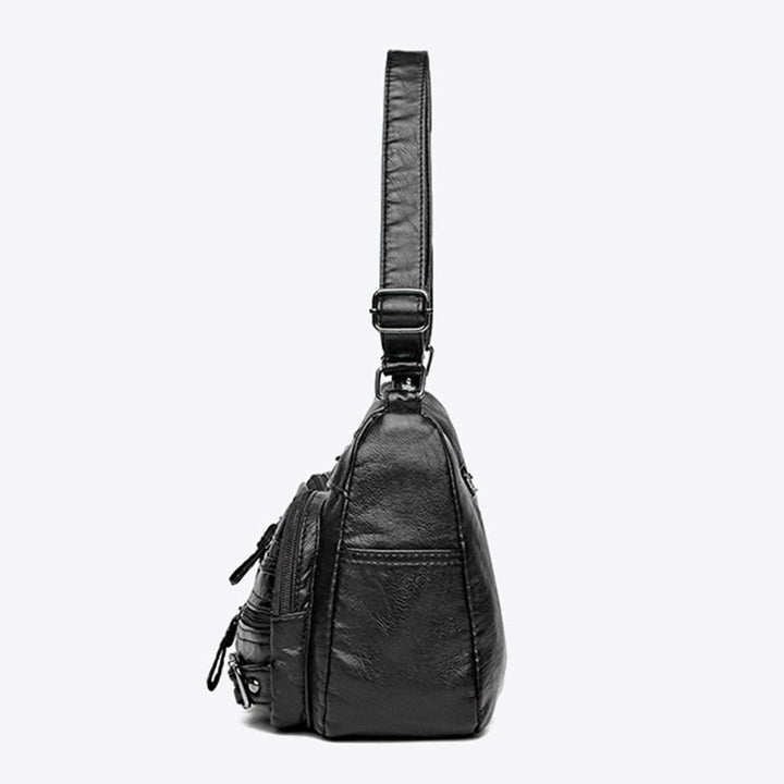 Minimalistische Ledergeldbörse mit mehreren Taschen für Damen. Organisierte Umhängetasche