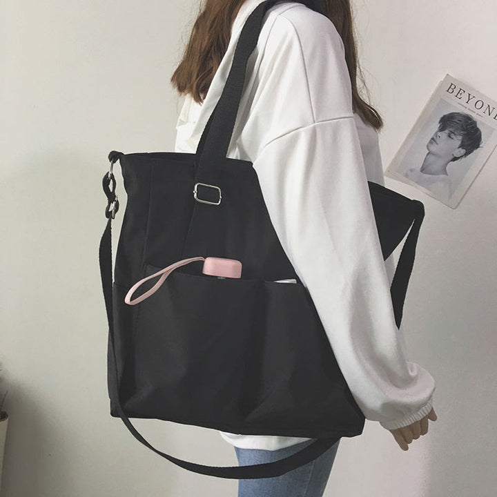 Große Tragetasche aus Canvas mit mehreren Taschen, funktionale Umhängetasche