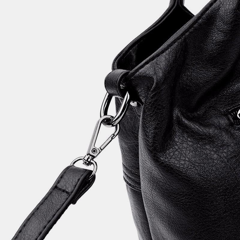 Weiche Lederhandtasche mit Nähten und fester Umhängetasche