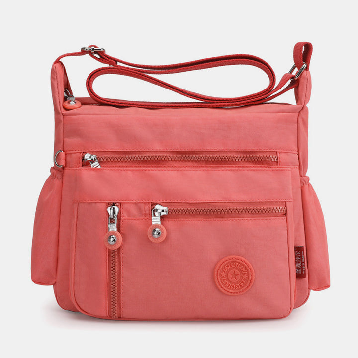Große, wasserdichte, leichte Umhängetasche mit mehreren Taschen - Koralle - image 16