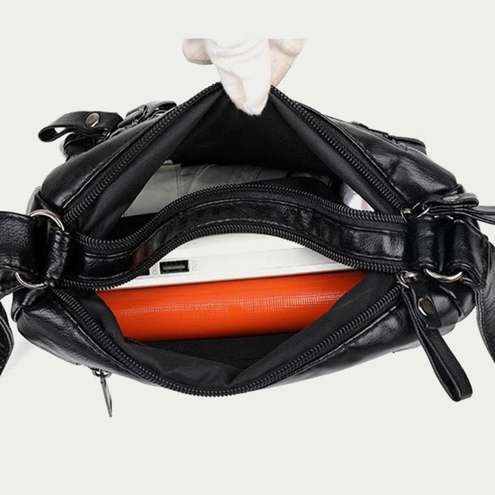 Minimalistische Tragetasche aus weichem Leder mit breitem Schultergurt