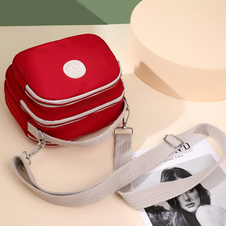 Kleine Handtasche mit dreifachem Reißverschluss für Damen, leichte, wasserdichte Umhängetasche