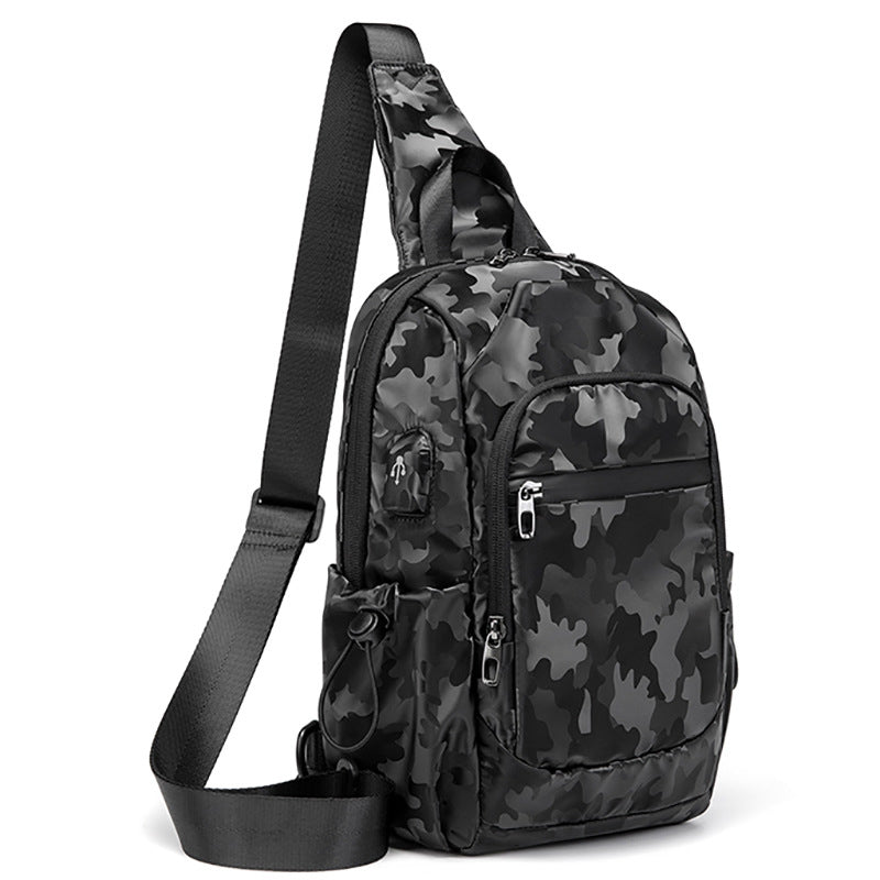 Kleine schwarze Sling-Umhängetasche für Damen und Herren, Tagesrucksack mit USB-Ladegerät