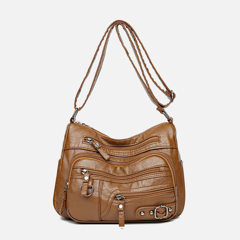 Minimalistische Ledergeldbörse mit mehreren Taschen für Damen. Organisierte Umhängetasche