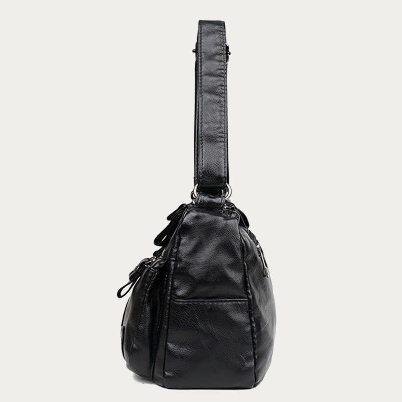 Minimalistische Tragetasche aus weichem Leder mit breitem Schultergurt