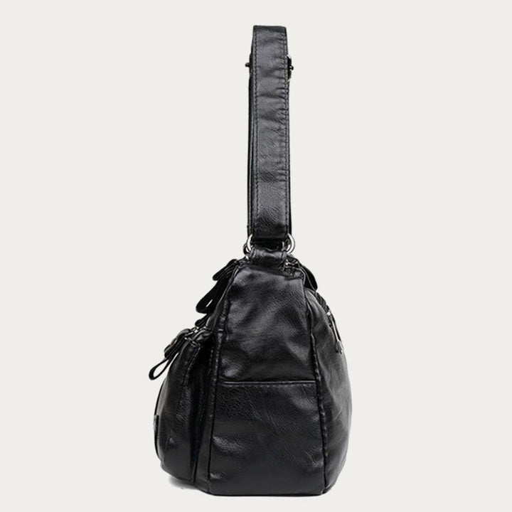 Minimalistische Tragetasche aus weichem Leder mit breitem Schultergurt