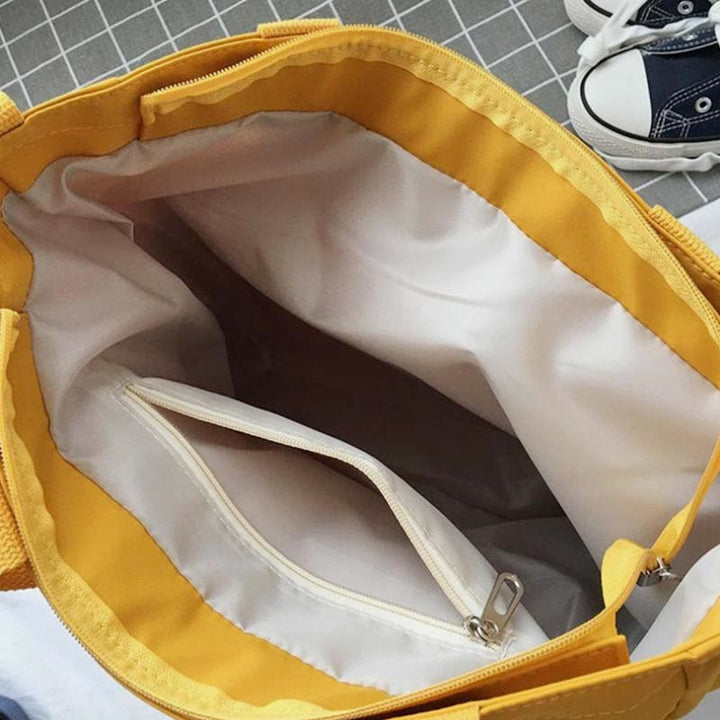 Große Tragetasche aus Canvas mit mehreren Taschen, funktionale Umhängetasche