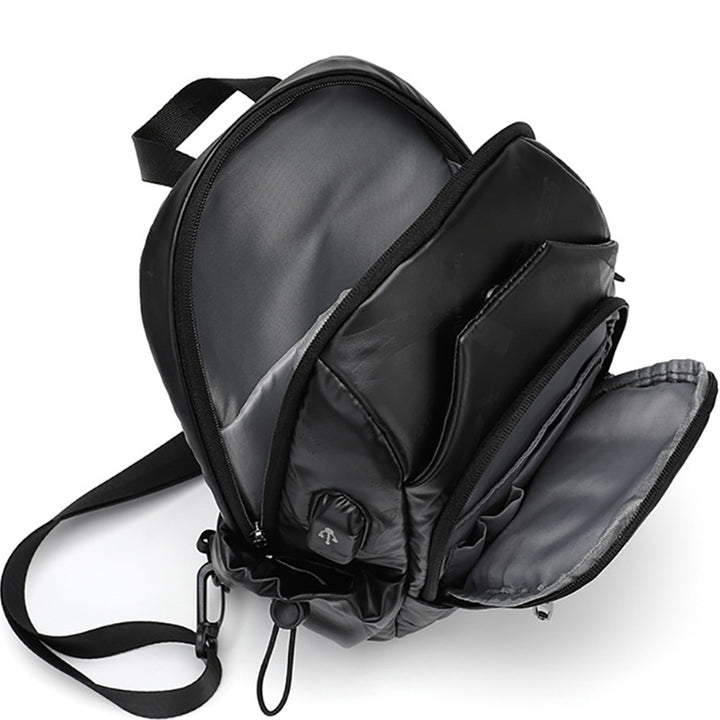 Kleine schwarze Sling-Umhängetasche für Damen und Herren, Tagesrucksack mit USB-Ladegerät