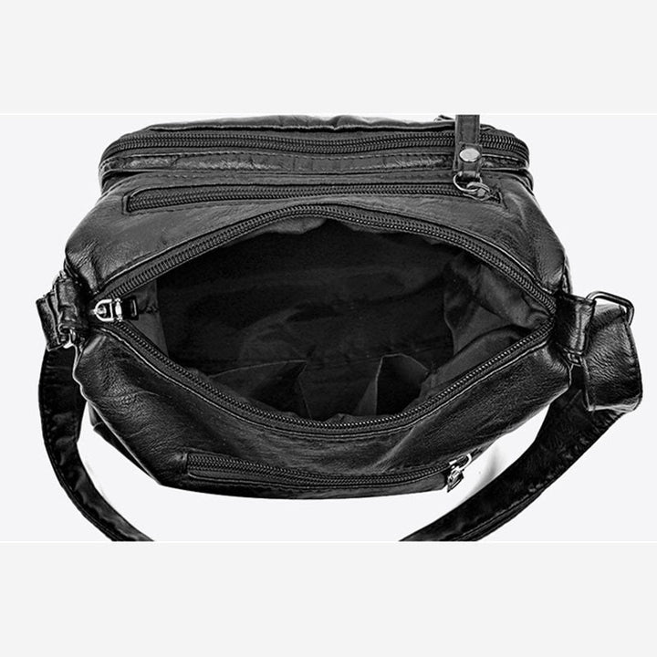 Minimalistische Ledergeldbörse mit mehreren Taschen für Damen. Organisierte Umhängetasche